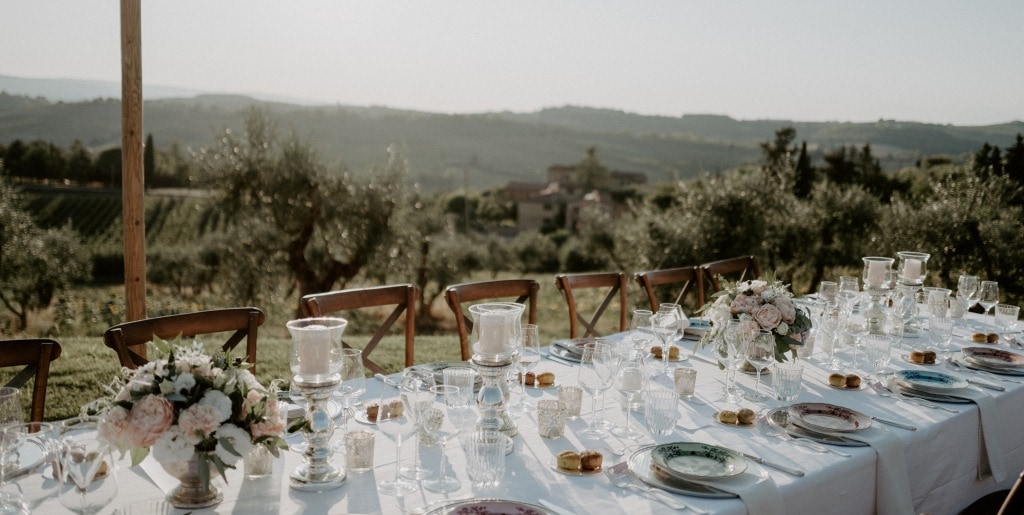 Country chic wedding dinner table at agriturismo in Chianti Tuscany