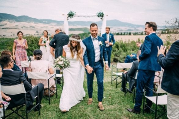 Newlyweds leave the ceremony site for the aperitif