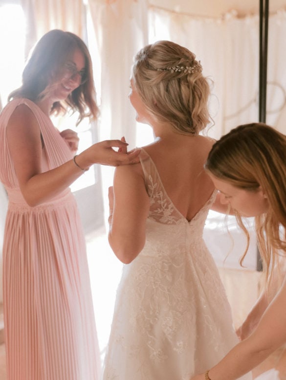 Back side of bridal dress and bridal hair.