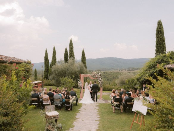 Elegant and stylish ceremony setting of outdoor symbolic wedding in Tuscany.