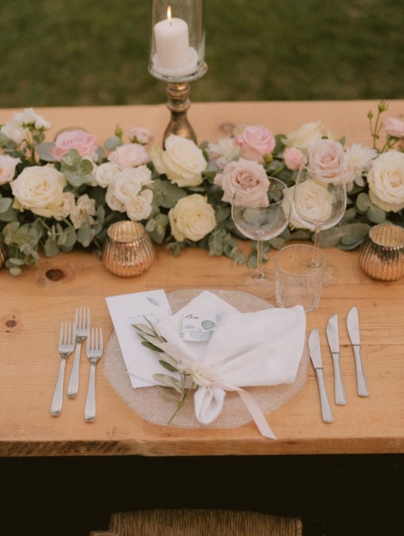 Elegant wedding table setting in white, blush and soft green.