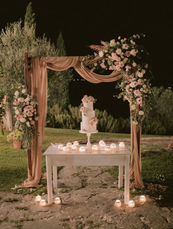 Tier wedding cake with blush pastel colored decoration.