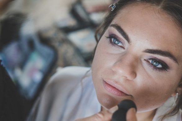 Detail of make up while bride is getting ready for her marriage in Tuscany.