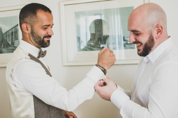 Groom is getting ready for his religious marriage in Tuscany with help of best man..