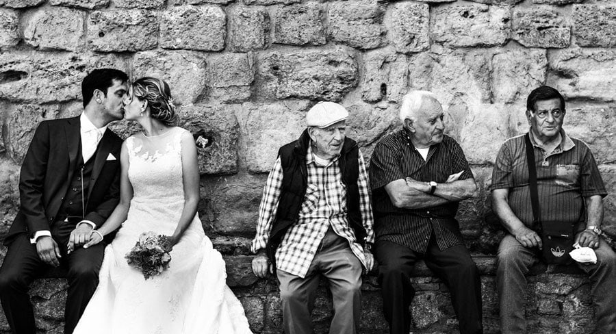 Dutch wedding couple with old italian men, Volterra Italy