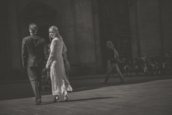 Bride and groom walking in Florence historic centre