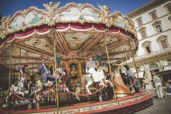 Fun photo of bridal couple in carousel Florence