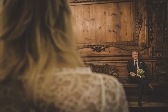 Groom happily looks at his wife to be